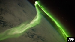 FILE - This NASA image released June 21, 2010, shows the Aurora Australis on May 29, 2010. The image was taken during a geomagnetic storm; the U.S. Space Weather Prediction Center has issued a warning for a strong geomagnetic storm on Saturday.