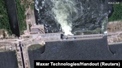 FILE - A satellite image shows a close-up view of Nova Kakhovka dam and hydroelectric power facility, Ukraine, June 5, 2023.