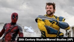 This image released by 20th Century Studios/Marvel Studios shows Ryan Reynolds as Deadpool/Wade Wilson, left, and Hugh Jackman as Wolverine/Logan in a scene from "Deadpool & Wolverine."