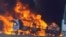 Smoke rises as a truck burns near the Myanmar-China border, near Muse, Myanmar, in this screen grab obtained from a social media video released on Nov. 23, 2023. 