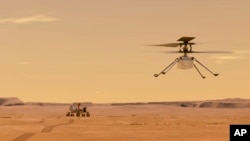 这幅由NASA提供的图像显示在火星上的“机智号”直升机飞离“毅力号”探测车。(NASA/JPL-Caltech via AP)