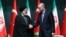 Turkey's President Tayyip Erdogan and Iran's President Ebrahim Raisi shake hands following a press conference in Ankara, Turkey, Jan. 24, 2024.
