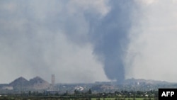 A plume of smoke rises in the area of the town of Toretsk, in Donetsk region on Aug. 24, 2025, amid the Russian invasion of Ukraine.