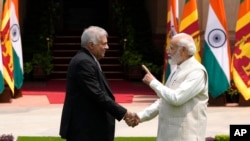 Indian Prime Minister Narendra Modi welcomes Sri Lankan President Ranil Wickremesinghe before their meeting in New Delhi, July 21, 2023.