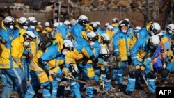 Police officers use shovels to work through the ruins of a popular shopping area that was destroyed by fire in the city of Wajima, Ishikawa prefecture, after a major 7.5 magnitude earthquake struck the region on New Year&#39;s Day.&nbsp;