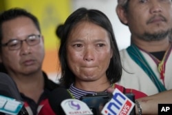 Pinnapa Prueksapan, wife of Porlajee "Billy" Rakchongcharoen, talks to reporters at the Central Criminal Court of Corruption and Misconduct in Bangkok to hear verdict, Sept. 28, 2023.