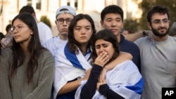 Pro-Israel demonstrators react while singing a song during a protest at Columbia University, Oct. 12, 2023, in New York.