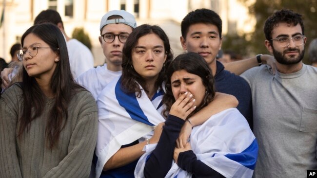 Pro-Israel demonstrators react while singing a song during a protest at Columbia University, Oct. 12, 2023, in New York.