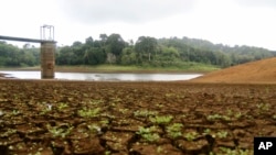 The almost dry water reservoir of Combani is visible, on the French Indian Ocean territory of Mayotte, Oct. 10, 2023. The government is pinning its hopes on the upcoming rainy season, though residents say it won't be enough to fix the deep-seated water problems.