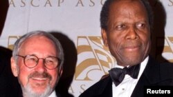 FILE - Canadian film director Norman Jewison, left, poses with actor Sidney Poitier in Beverly Hills, April 24, 2001.