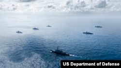 (FILE) Multinational ships sail in formation during the Pacific Dragon biennial exercise 2024, Aug. 11. 