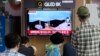 A TV screen shows a May 31, 2023, image of North Korea's rocket launch during a news program at the Seoul Railway Station in Seoul, South Korea, June 1, 2023. 