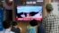 A TV screen shows a May 31, 2023, image of North Korea's rocket launch during a news program at the Seoul Railway Station in Seoul, South Korea, June 1, 2023. 