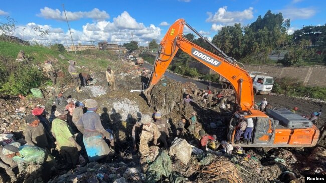 Scavengers sort recyclable plastic waste materials at the Dandora dumping site on the outskirts of Nairobi, Kenya, Nov. 16, 2023.