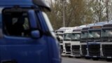 FILE - Ukrainian trucks wait at the Hungary-Ukraine border, in Zahony, Hungary, April 19, 2023. A protest by Hungarian truckers planned in Zahony on Dec. 11, reportedly will aim to slow the movement of trucks and demand restrictions on Ukrainian haulers working in the EU.
