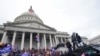 FILE - Rioters loyal to US President Donald Trump swarm the US Capitol in Washington, Jan. 6, 2021. 