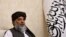Taliban's acting commerce minister Haji Nooruddin Azizi speaks during an interview with Reuters, at the Embassy of Afghanistan in Beijing, China, Oct. 19, 2023. 