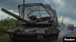 Ukrainian servicemen ride tanks, amid Russia's attack on Ukraine, near the Russian border in Sumy region, Ukraine Aug. 10, 2024.