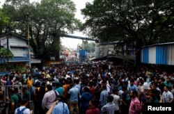 Doctors, paramedics and medical students gather in Kolkata, India, to protest what they say was the rape and murder of a trainee doctor inside a state-run hospital facility in Kolkata, the capital of the state of West Bengal. Aug. 14, 2024.