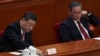 中国领导人习近平和中国总理李强在北京人大会堂出席全国人大会议闭幕式期间习近平在投票。（2024年3月11日）