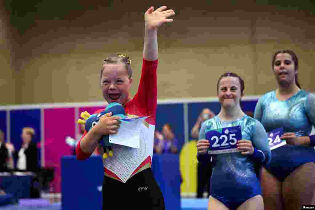 Annabelle Tschech-Loeffler, a 13-year-old German artistic gymnast who has Down syndrome, reacts during the presentation of the athletes for the gymnastics competition at the Special Olympics World Games Berlin 2023.