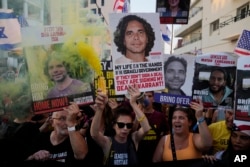 Israelis protest near the hotel where U.S. Secretary of State Antony Blinken is staying during his visit with Israeli Prime Minister Benjamin Netanyahu and leadership about a deal to halt the war in Gaza and free hostages, in Tel Aviv, Aug. 19, 2024.