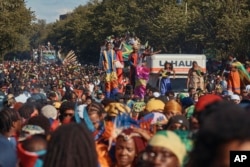 Revelers march at the intersection of Franklin Avenue and Eastern Parkway during the West Indian Day Parade, Sept. 2, 2024, in the Brooklyn borough of New York.