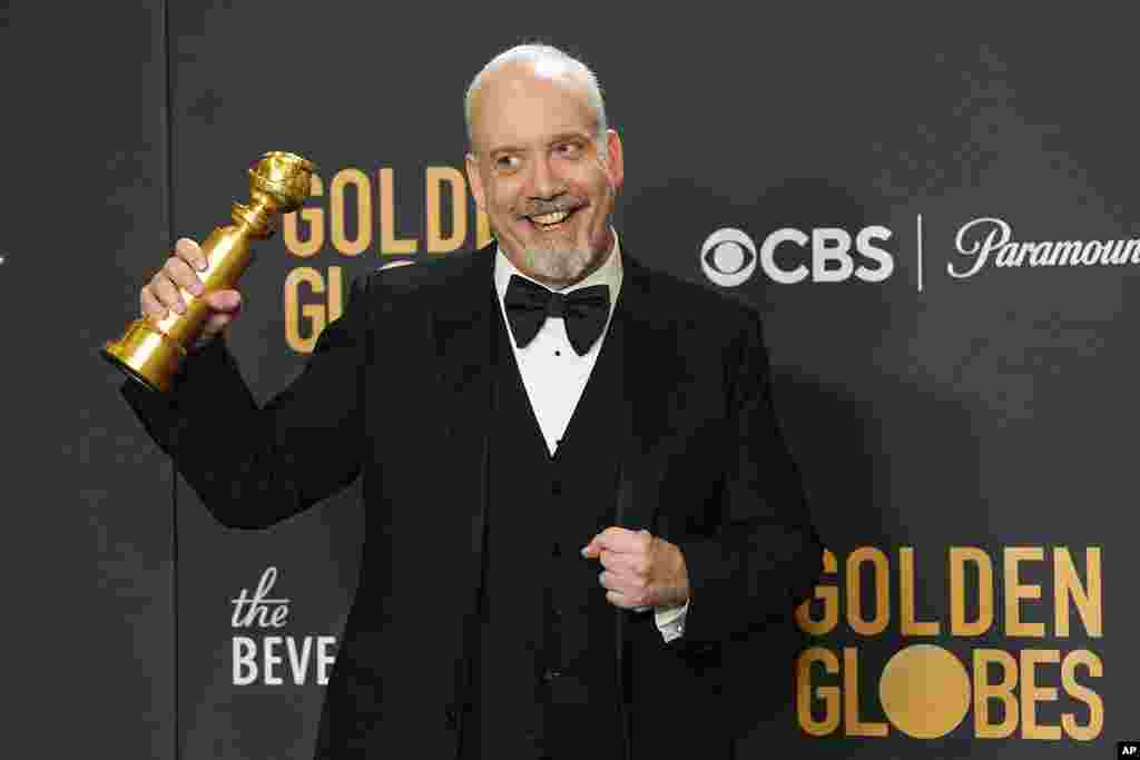 Paul Giamatti poses in the press room with the award for best performance by an actor in a motion picture, musical or comedy for &quot;The Holdovers&quot; at the 81st Golden Globe Awards on Jan. 7, 2024,
