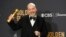Paul Giamatti poses in the press room with the award for best performance by an actor in a motion picture, musical or comedy for "The Holdovers" at the 81st Golden Globe Awards on Jan. 7, 2024,