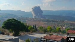 Smoke billows from the site of an Israeli airstrike on Zibqin in southern Lebanon on Aug. 25, 2024, amid escalations in the ongoing cross-border tensions as fighting continues between Israel and Hamas militants in the Gaza Strip.