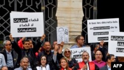 FILE - Tunisian judges and lawyers gather in a protest calling upon authorities for independence in the judicial system, in Tunis on June 1, 2023. 