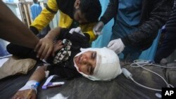 Palestinians wounded in the Israeli bombardment of the Gaza Strip are brought to a hospital in Rafah, Dec. 11, 2023.