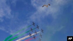 The Frecce Tricolori (Tricolor Arrows) aerobatic group of the Italian Air Force flies with a bird at the end of the celebrations for the 77th Republic Day in Rome. Republic Day marks the anniversary of the birth of the Italian Republic after a referendum held on June 2, 1946 in which Italians chose between monarchy and a republic following World War Two.