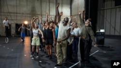 Dancers rehearse for "Dance of the Games" at the concert hall in Creteil, east of Paris, July 31, 2024.