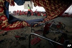 Chairs with blood stain are seen on the ground after Sunday's suicide bomber attack in the Bajaur district of Khyber Pakhtunkhwa, Pakistan, July 31, 2023.