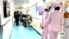 South Africans line up for medical care during Chinese hospital ship stop