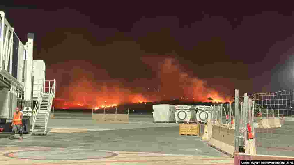 A wildfire burns near the Sicilian airport &quot;Falcone-Borsellino&quot; in Punta Raisi near Palermo, Italy.
