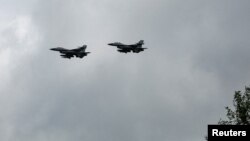 Ukrainian F-16 fighter jets are seen in the air during marking the Day of the Ukrainian Air Forces in an undisclosed location, Aug. 4, 2024. Ukraine's air force said on Aug. 29 that one of the F-16 warplanes that Ukraine had received from its Western partners has crashed.