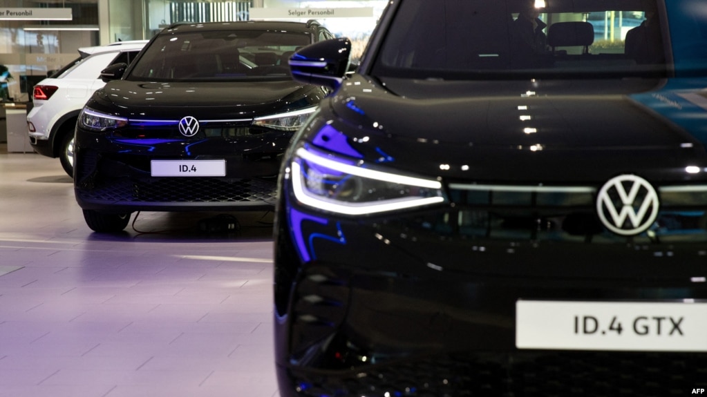 FILE - A photo taken on Jan. 20, 2023 shows the logo of German car manufacturer Volkswagen VW on an electric Volkswagen cars ID4 and ID4 GTX at a car dealership in Oslo. Norwegians bought 10,480 new EVs in August, bringing the total to 68,435 since the start of the year.