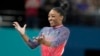 Simone Biles, of the United States, celebrates after completing her routine in the women's artistic gymnastics individual floor exercise finals at Bercy Arena at the 2024 Summer Olympics, in Paris, France, Aug. 5, 2024.