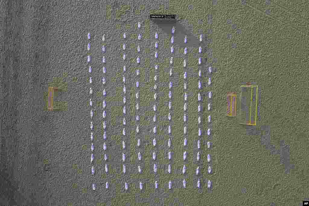 Shrouds that represent Palestinian children who have been killed during the latest Israel-Hamas war lay on Copacabana beach in Rio de Janeiro, Brazil.