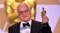 FILE - James Ivory poses with the Oscar for Best Adapted Screenplay for 'Call Me by Your Name,' during the 90th Annual Academy Awards on March 4, 2018, in Hollywood.