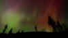 FILE - The Northern Lights are seen May 10, 2024, in Estacada, Ore. The National Oceanic and Atmospheric Administration said Aug. 12 that Earth had been hit by a solar storm that could bring the Northern Lights to night skies farther south than normal.