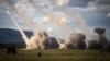 Missiles are launched from a U.S. military HIMARS system during joint military drills at a firing range in Shoalwater Bay, Australia, July 22, 2023. New U.S. military aid for Ukraine will include artillery rounds and munitions for HIMARS on the Ukraine front lines.