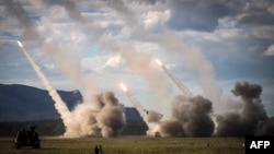 A missile is launched from a US military HIMARS system during joint military drills at a firing range in northern Australia as part of Exercise Talisman Sabre, in Shoalwater Bay, July 22, 2023. 