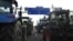 Farmers drive their tractors a highway leading to Paris's main airport, Jan. 29, 2024 near Chamant, north of Paris. 