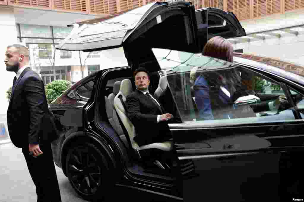 Tesla Chief Executive Officer Elon Musk gets in a Tesla car as he leaves a hotel in Beijing, China.