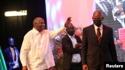 FILE - Ivory Coast's former president Laurent Gbagbo gestures during the second day of a meeting to launch the formation of a new political party at the Sofitel hotel in Abidjan, Ivory Coast on October 17, 2021. 