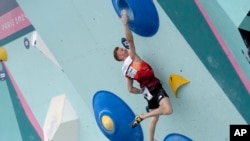 Jakob Schubert of Austria competes in the men's boulder and lead, boulder final, during the sport climbing competition at the 2024 Summer Olympics, Aug. 9, 2024, in Le Bourget, France. 