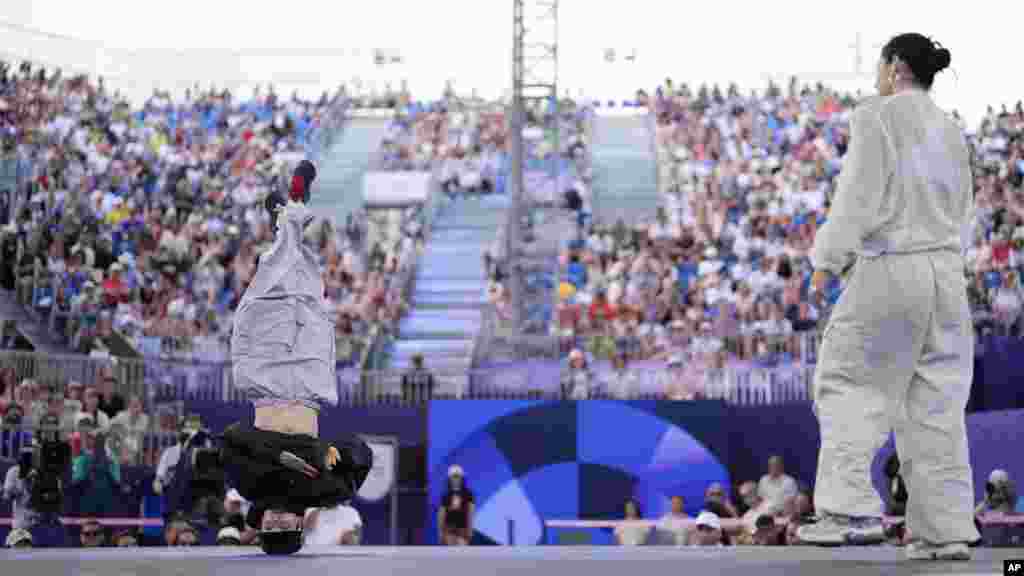 Ukraine's Kateryna Pavlenko, known as B-Girl Kate, right, and Ukraine's Anna Ponomarenko known as B-Girl Stefani, compete during the Round Robin Battle at the breaking competition at the 2024 Summer Olympics in Paris.